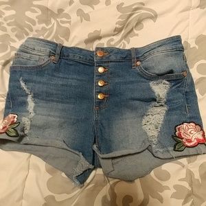 Distressed denim shorts with rose